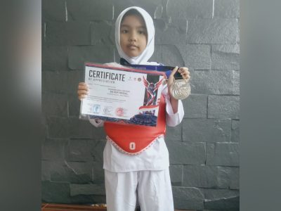 Shanum Hana Hafizah, berhasil meraih medali perak dalam ajang The Pugnator International Open Taekwondo 2026. (HaloPWK)